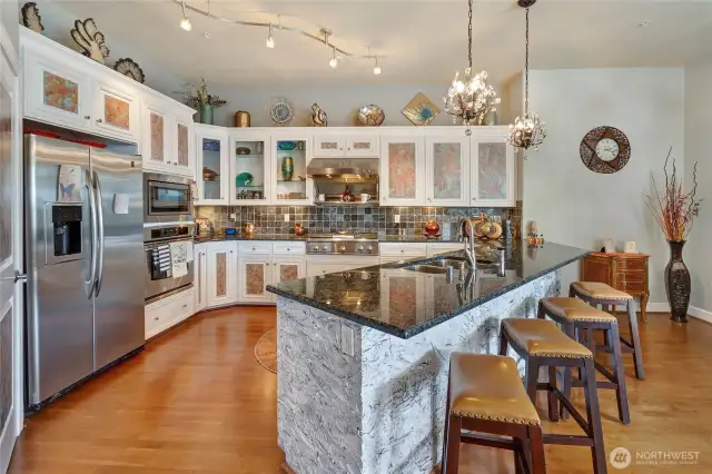 Chef's Kitchen with GE Monogram SS Appliances, Gas range, with commercial hood and warming rack, new dishwasher and pantry.