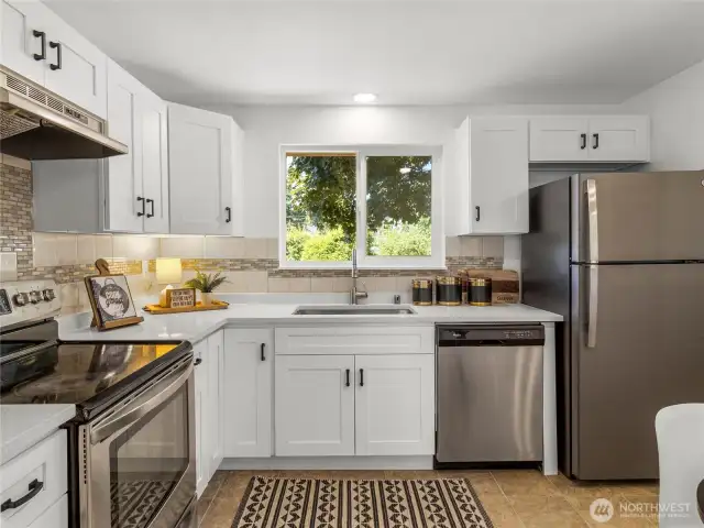 All new cabinets, countertops, kitchen sink, and hood vent. All appliances stay!