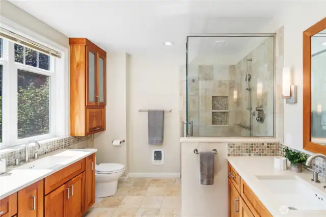 Updated primary bathroom w/ tile shower & dual sinks