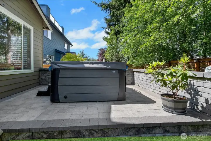 Large patio with retaining wall