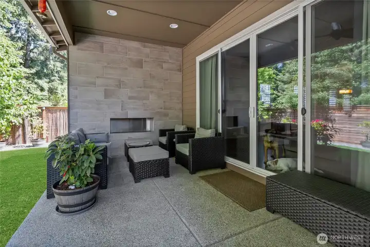 Back deck with double sliding glass doors, gas fireplace and gas hook up for grill