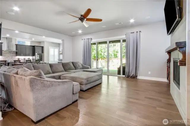 Living room with sliding double glass doors to backyard