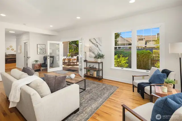 Warm and welcoming family room. Rich hardwood floors throughout much of main living area