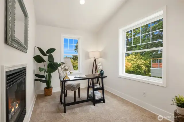 Private office attached to the primary bedroom with view through fireplace!