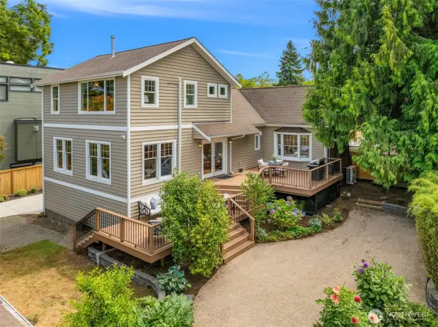 Large partially fenced yard with expansive outdoor living space