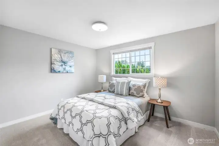 One of the home’s additional bedrooms offers flexibility for guests, a home office, or hobbies.