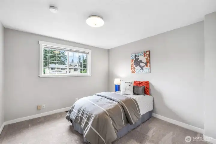 The third bedroom offers comfortable space and natural light, perfect for use as a guest room, home office, or personal retreat.