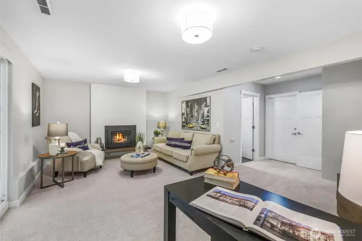 A second angle of the family room highlights its size and flexible layout. With space for seating and activities, this level expands the home’s livability.