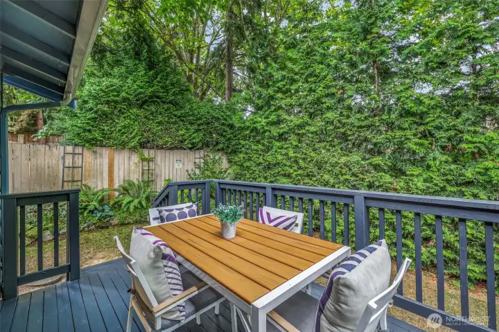 A second angle of the deck shows how it overlooks the landscaped yard, creating a serene and private retreat.