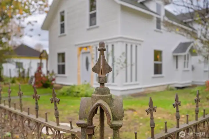The original wrought iron gate and fence is still in great condition.