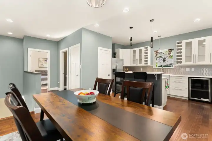 Enjoy an open-concept layout that connects the elegant dining space to a beautifully updated kitchen. Wine storage in the shelves and the included wine refrigerator.