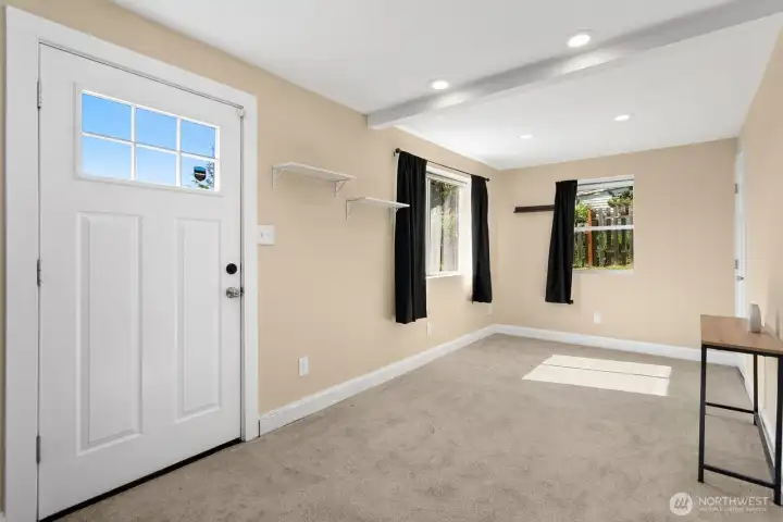 Bright and versatile lower-level living space with direct access to the backyard deck and patio.