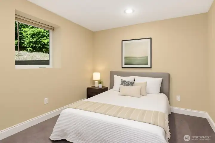 Virtually Staged. Bedroom concept for one of the lower rooms.