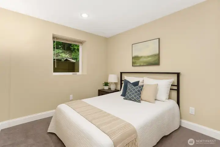 Third bedroom features a casement window and recessed lighting. Virtually Staged.  Sellers used this room for a home gym.