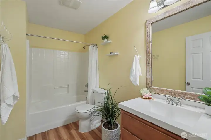 Hall bath with full tub/shower combo. Quartz counters and updated flooring.
