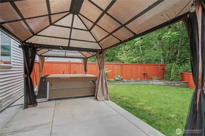 Exterior includes an extended patio, covered gazebos and a salt water hot tub!