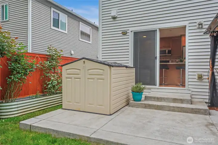 Storage shed included.