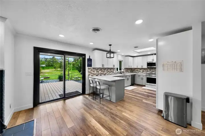 From the dining space into kitchen with eating space and out the sliding door to the recently added Trex deck that runs the backside of the home, this home offering the ease of gatherings and entertainment!