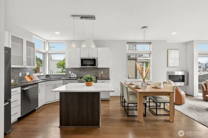 Chef's kitchen with island, quartz counters and stainless appliances