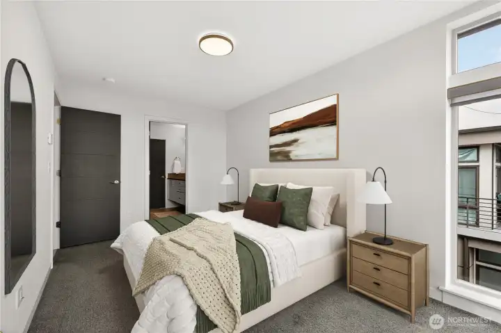 Primary suite with corner windows and en suite bath (virtually staged)