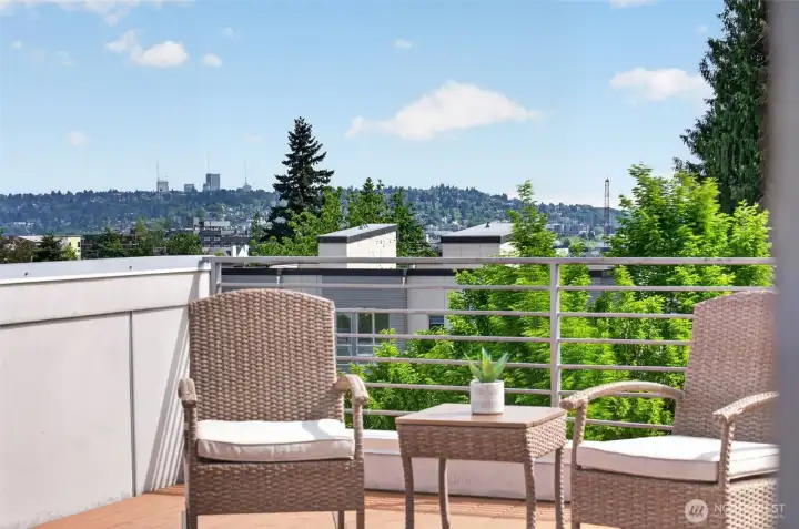 Rooftop seating area with city and Rainer views