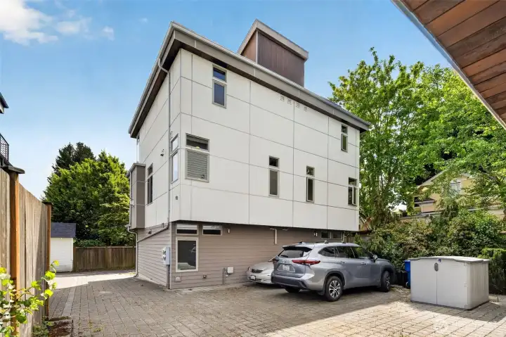 Rear exterior showing private parking off alley