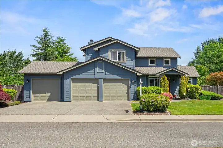 View of the home from the street, 3 car garage.