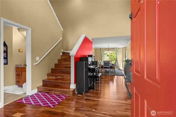 Entryway with view of well appointed staircase