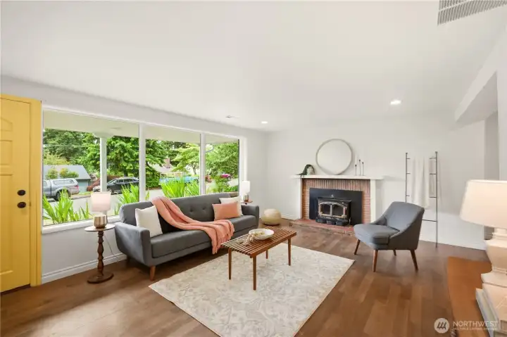 Another look at the spacious living room. There are also recessed can lights in the ceiling.