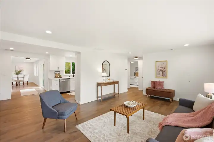 The living room also opens to the kitchen, sliding door to the rear patio and the dining area. To the right are 2 bedrooms and a full bathroom.