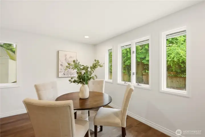 Years ago a previous owner added a large family room/dining area off the rear of the home. It's been updated with recessed lighting and new engineered flooring.