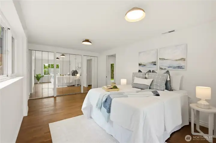 The primary bedroom also features a wall long set of closets.