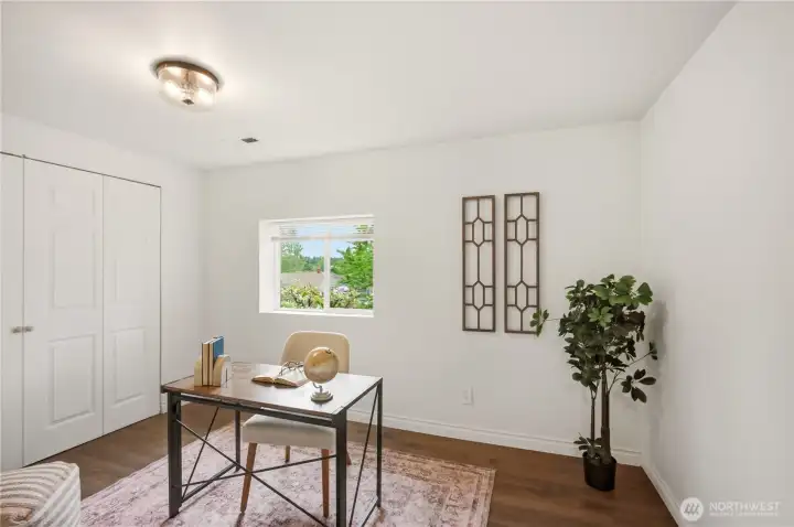 The front bedroom is currently staged as an office.