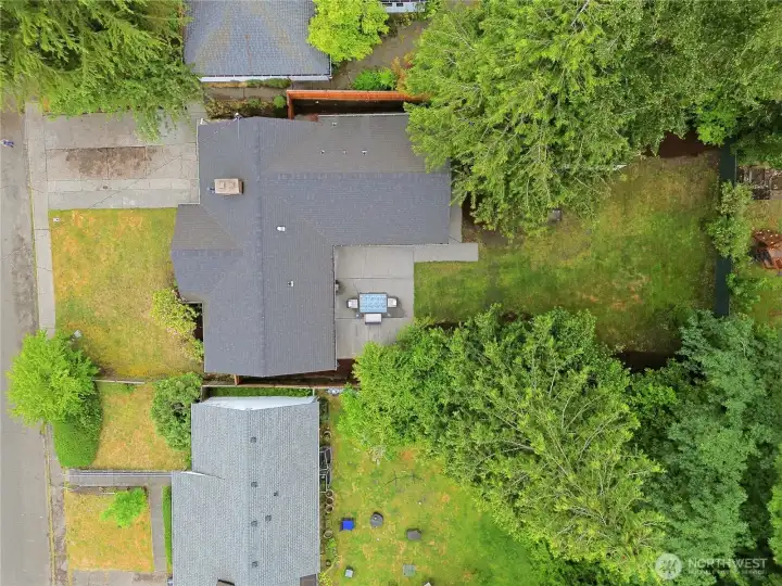 A drone shot from directly above showing the home and the lot... and the newer roof!