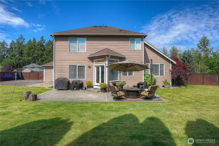 Check out this incredible space. Sit out and enjoy a sunny day, BBQ, and enjoy your people. This area gets wonderful sun most of the day. You can see your gorgeous arboreta and hydrangea sitting in the sun. You also have resident hummingbirds that come to visit you most days.