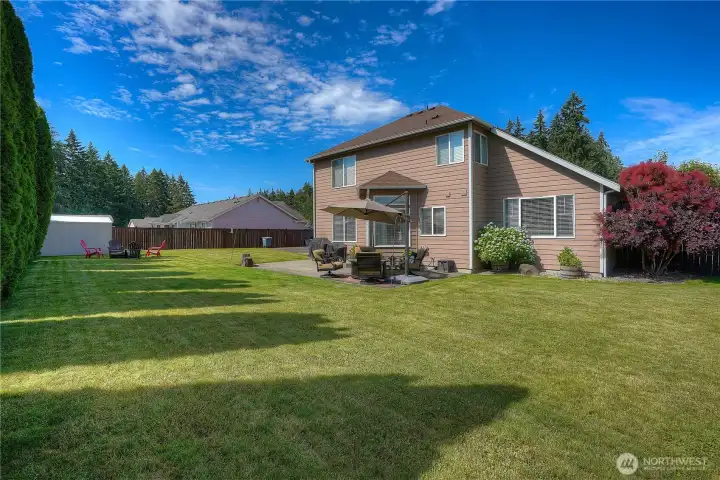 Sprinkler system throughout the back and front yards keeps your grass green most of the year. The entire yard gets warm sunshine almost all day. With the large hedge trees in the back, you have almost complete privacy.