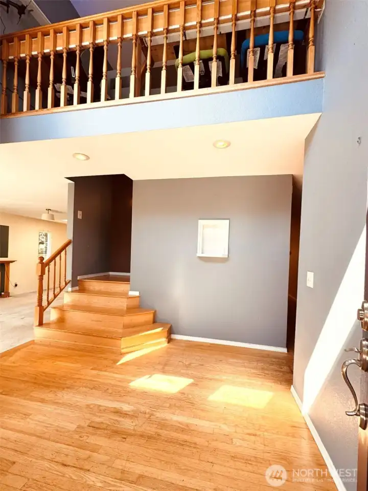Open, vaulted ceiling greet you as you enter the house.