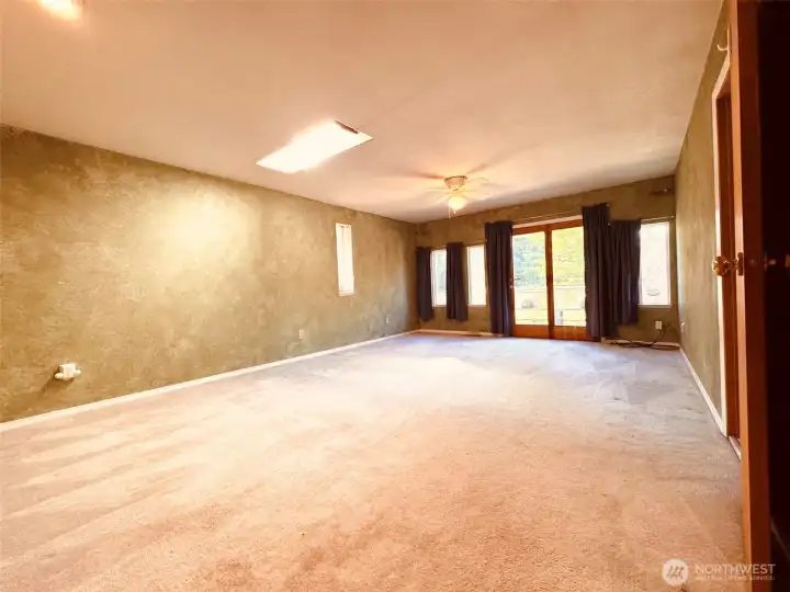 This is not a living room.  This is the PRIMARY Suite.  It is HUGE!