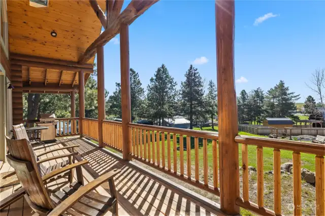 The back porch, an extension of the wraparound porch, where you will find mountain views for days.  Take in a leisurely afternoon soaking up the sun while you plan the yard projects, family gatherings and fun times to come.