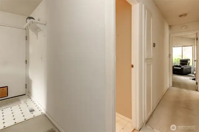 Elegant, circular floor plan with hall leading to kitchen and hall leading to bedrooms
