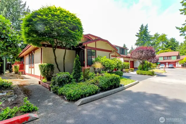 As you approach the home, you will see the front walkway first  and on the right side of the unit is the garage with driveway parking.