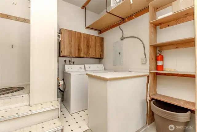 The laundry room in garage has custom made cabinetry adjacent to it for folding clothes.  The gas furnace is next to the appliances.