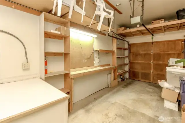 The garage has overhead storage shelving as well