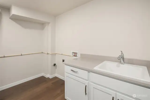 Laundry room with utility sink and counter