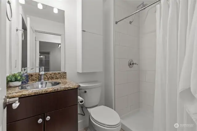 Bathroom with large medicine cabinet and washer & Dryer.