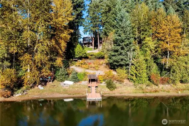 Beautiful property with 280 ft low-bank waterfront on the serene Hidden Lake!