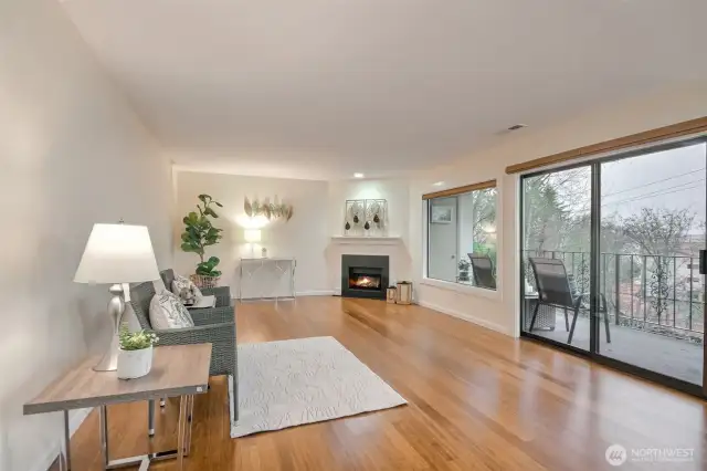 Living room have cozy fireplace and gas included in HOA dues.  Sliding glass door to the large deck and there is storage too