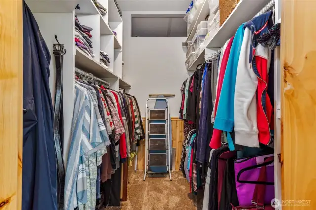 Large walk in closet with additional storage space.