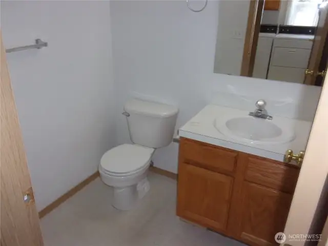 Handy half-bath near the laundry room.