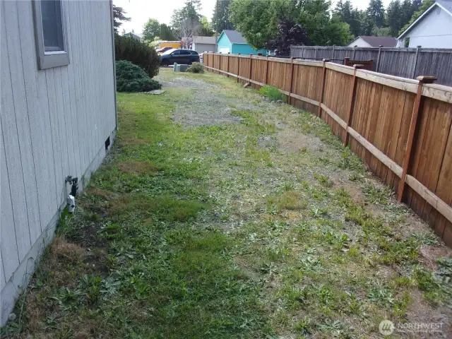 North side of dwelling has plenty of room for an RV or boat.